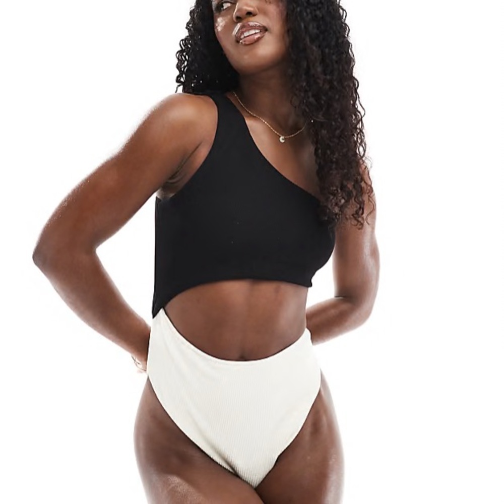 The Frolic exclusive one shoulder cut out swimsuit black and cream color block